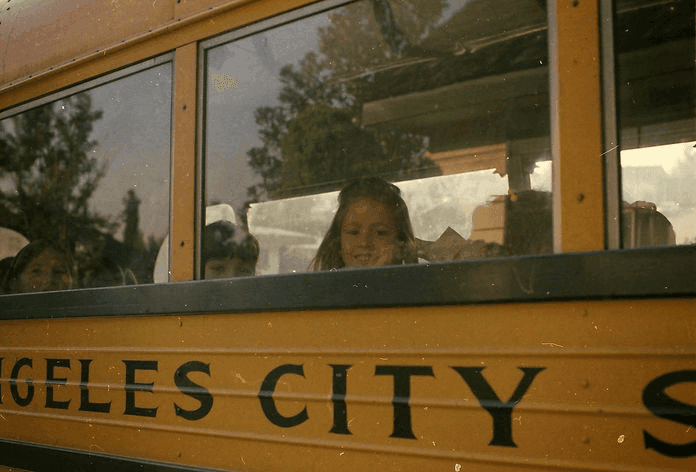 A Laurelwood child looking out the window of a Los Angeles City Schools bus in the early 1970s.